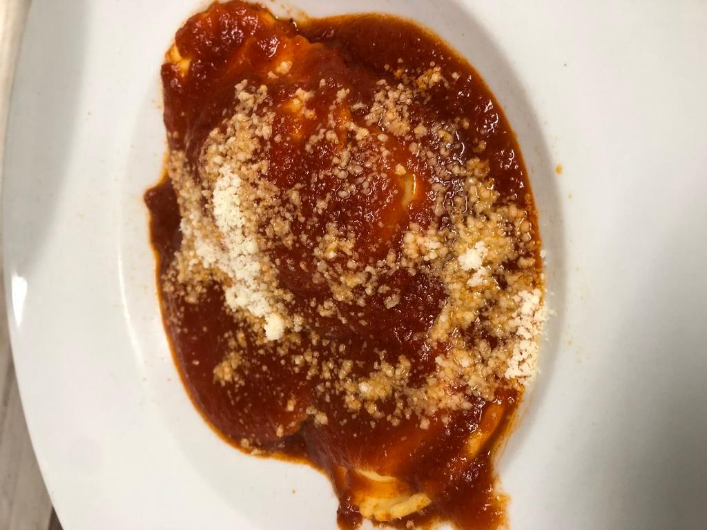 Ravioli Pomodoro · Fresh cheese ravioli stuffed with seasoned ricotta with homemade tomato basil sauce.