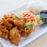 T-5. Chicken Katsu · Breaded deep-fried chicken breast cutlet with katsu sauce, rice and salad.