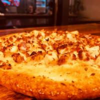 Chicken-bacon ranch T-zza · It’s not a flat bread, it’s not a pizza, it a T-zza. Chicken, topnotch bacon and onions hous...