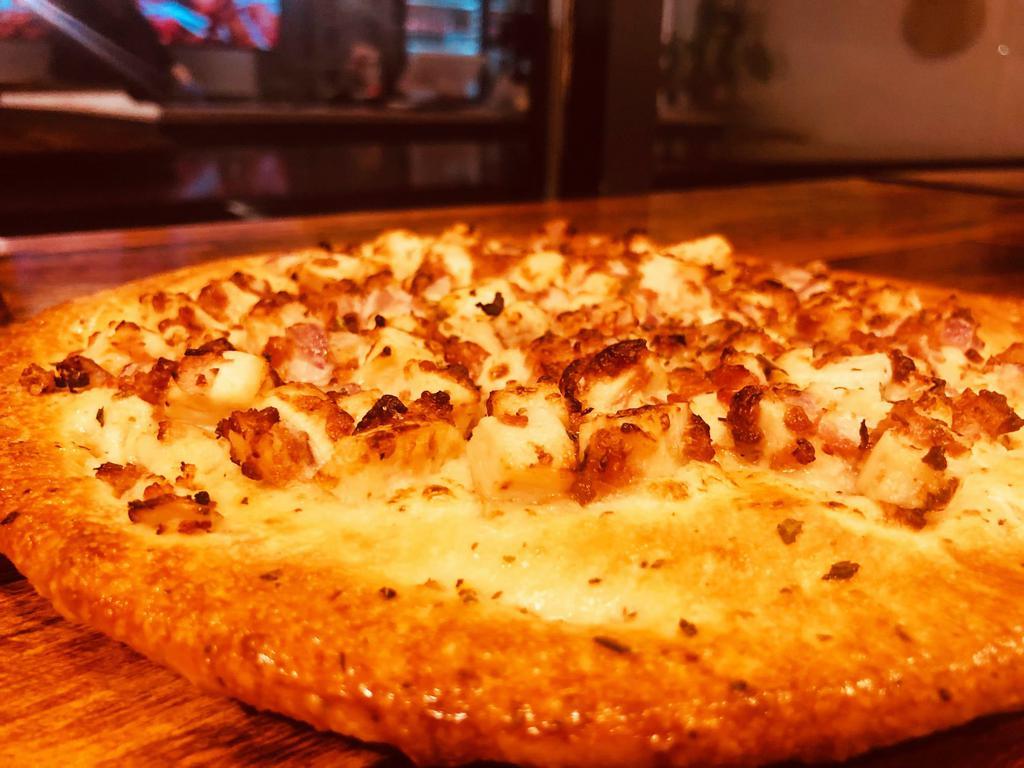 Chicken-bacon ranch T-zza · It’s not a flat bread, it’s not a pizza, it a T-zza. Chicken, topnotch bacon and onions house made ranch sauce over an ad-hoc crust (no marinara sauce, no cheese)
