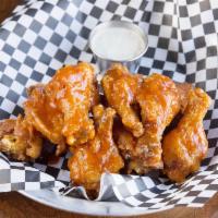 Finley's Crispy Wings · Crispy fried chicken wings tossed to order in your choice of sauce. Served with ranch or blu...