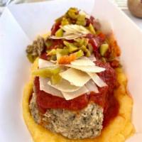 Larry's Big Meatballs · Veal, pork and beef meatballs with marinara served over creamy-cheesy polenta with hot cherr...