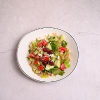 Greek Cleopatra Salad · Fresh romaine hearts, feta, red onions, Kalamata olives, cucumber and tomatoes in our homema...