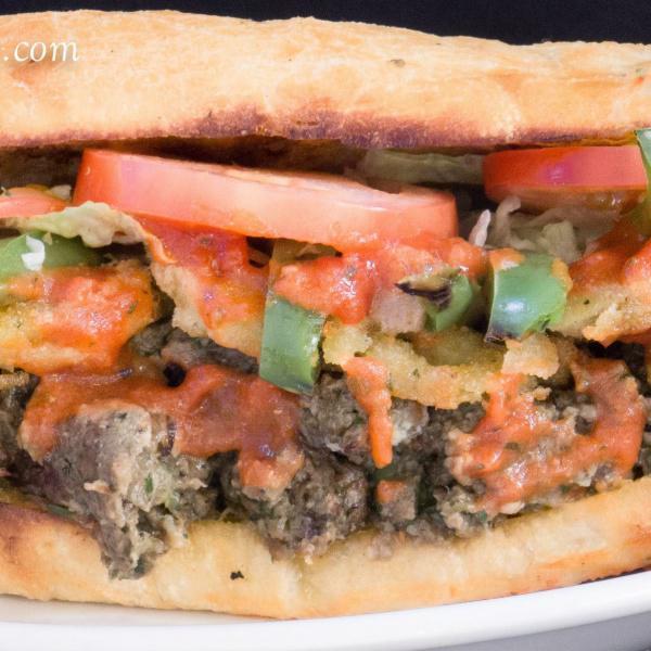 Meatball Sandwich · Mediterranean meatball and mozzarella cheese. Topped with marinara sauce and spicy giardiniera peppers. Includes lettuce and tomato.