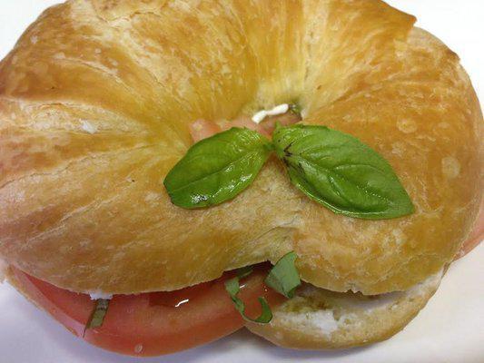 Goat Cheese Basil Sandwich · Goat cheese, basil, tomato and olive oil on a croissant.