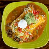 Burrito Supreme · 2 burritos with bean and your choice of meat smothered with green chili and cheese. Topped w...