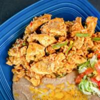 Arroz con Pollo · Chicken breast chunks cooked with green bell pepper, onions and rice, finished with a touch ...