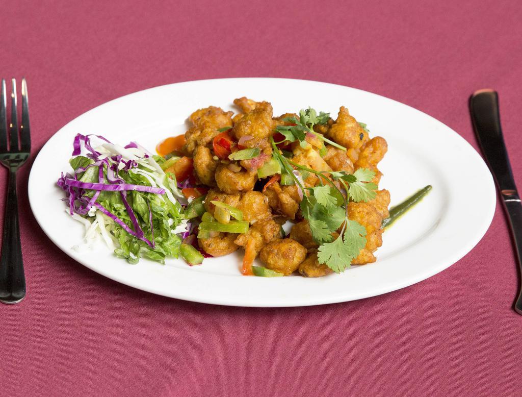 Kurkure Shrimp · Crisp shrimp stir fried with onions, red peppers and green peppers. House favorite.