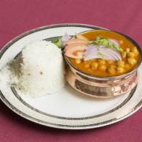 Chole Batur · Garbanzo beans is beautifully cooked to perfection served traditionally with bature, a fried...