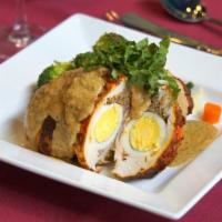 Mint Special Murg Mussalam · Chicken breast is stuffed with lamb and egg, braised in tandoor lightly simmered in nutty fl...