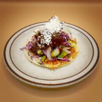 Mexican Cotija Taco · Cotija patty, grilled seasonal veggies, chingon slaw, and pasilla lime salsa.