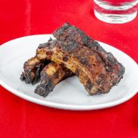 Jerk Ribs Appetizer · Pork ribs, dry-rubbed with jerk seasonings, marinated, then finished on a charbroiler grill.