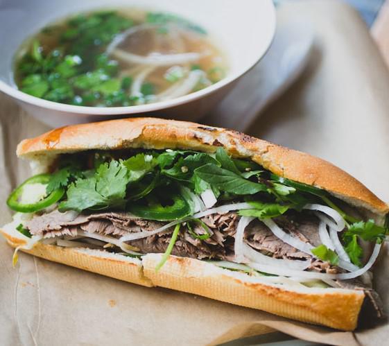 Brisket Banh Mi French Dip Pho (Bánh Mì Nạm & Phở Bò) · Comes with mayo, pate, Beef Brisket, daikon & carrot pickles, cucumber, cilantro, jalapeno, house dressing on a toasted baguette.
Served with a bowl of beef broth. 