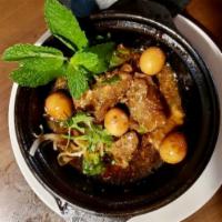 Caramelized & Braised Pork with Quail Egg (Thịt kho Trứng Cút & Bánh Mì) · Served with French Baguette, cabbage pickles.
Pork Rib & Pork Belly.
Cooked in Clay Pot! 
*P...