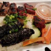 Combo Three Flavored Grilled Beef over White Rice (Cơm bò 3 món) · Grilled Betel Leaf Beef, Sesame Beef and Lemongrass Beef
Served with daikon & carrot pickles...