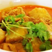 Chicken Curry with Baguette (Bánh mì cà ry gà) · Yellow chicken curry with carrots and potatoes.