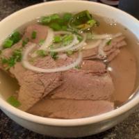 Beef Brisket Noodle Soup (Nạm) · Beef broth and rice noodle. Topped with scallion, onion, cilantro and side dishes of bean sp...