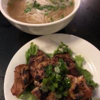 BBQ Short Rib Noodle Soup (Phở sườn bò nướng) · Beef broth and rice noodle. Topped with scallion, onion, cilantro and side dishes of bean sp...