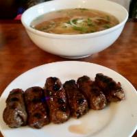 Grilled Sesame Beef Brochette Noodle Soup (Phở bò lụi) · Beef broth and rice noodle. Topped with scallion, onion, cilantro and side dishes of bean sp...