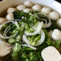 Fish Ball Noodle Soup (Phở Cá Viên) · Beef broth and rice noodle. Topped with scallion, onion, cilantro and side dishes of bean sp...