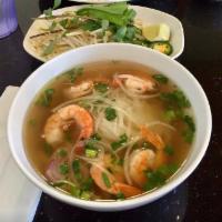 Grilled Shrimp Noodle Soup (Phở tôm nướng) · Beef broth and rice noodle. Topped with scallion, onion, cilantro and side dishes of bean sp...