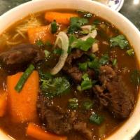 Beef Stew Noodle Soup (Phở bò kho) · Beef Stew, carrots, potatoes and rice noodle. 
Topped with scallion, onion, cilantro and sid...