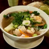 Seafood Noodle Soup (Phở đồ biển) · With Shrimp, Squid, Fish Ball, Crab Meat, mixed Vegetables, Beef broth and rice noodle.
Topp...