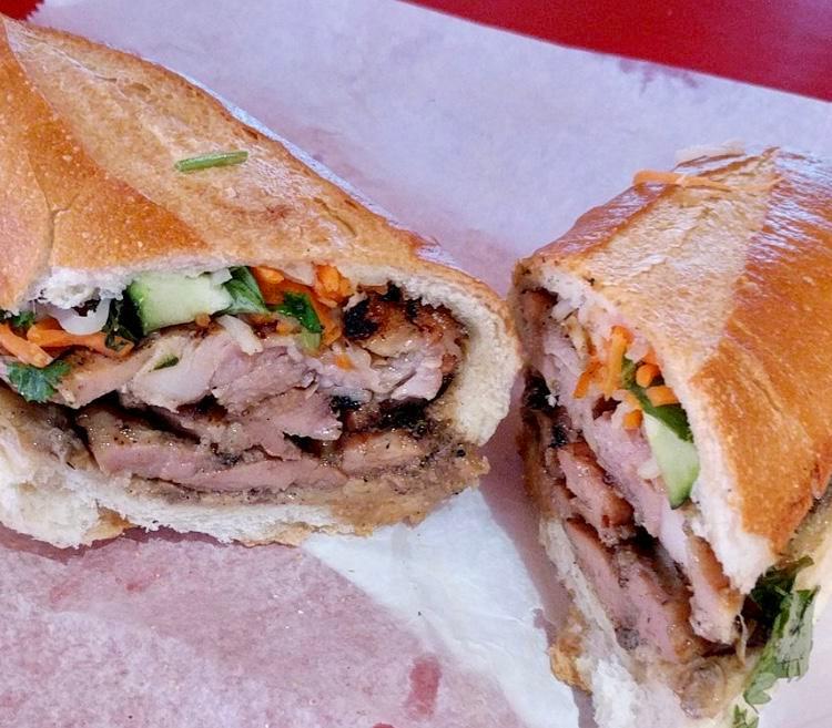 Grilled Sliced Pork Sandwich (Bánh mì thịt nướng) · Served with mayo, pate, cucumber, daikon and carrot pickles, cilantro, house special dressing. 