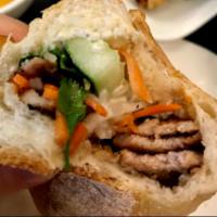 Grilled Chicken Sandwich (Bánh mì gà nướng) · Mild spicy BBQ dark meat chicken.
Served with mayo, pate, cucumber, daikon and carrot pickle...