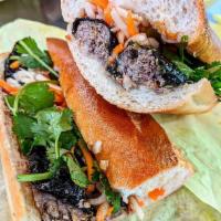 Grilled Betel Leaf Beef Sandwich (Bánh mì bò nướng lá lốt) · Seasoned minced beef, wrapped in wild betel leaf and grilled.
Served with mayo, pate, cucumb...