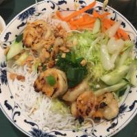 Grilled Shrimp over Rice Vermicelli (Bún tôm nướng) · Served with shredded lettuce, cucumber, pickles daikon and carrot, scallion oil garnish, cru...