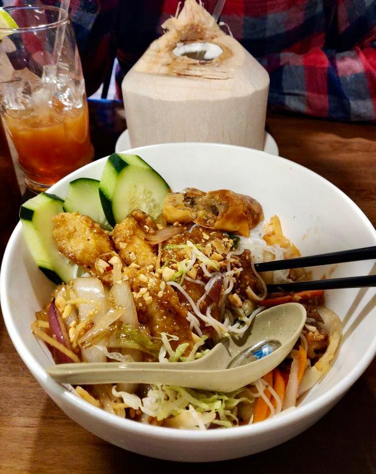 Fried Catfish over Rice vermicelli (Bún cá chiên) · Served with shredded lettuce, cucumber, pickles daikon and carrot, scallion oil garnish, crushed roasted peanuts and fish sauce on the side.