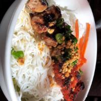 Two Flavored Grilled Beef over Rice Vermicelli (Bún bò lụi và bò nướng sả) · Grilled Lemongrass Beef and Grilled Sesame Beef.
Served with shredded lettuce, cucumber, pic...
