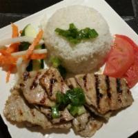 Grilled Sliced Pork over White Rice (Cơm thịt nướng) · Served with daikon & carrot pickles, tomato, cucumber, scallion oil garnish, fish sauce (on ...