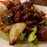 Sauteed Marinated Chicken cubes over White rice (Cơm gà lúc lắc) · *Recommend with fried rice.