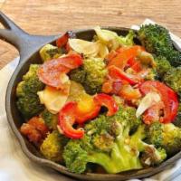 Spicy Charred Broccoli · Hot cherry peppers, pancetta, garlic and butter. Gluten free.