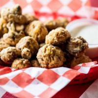Fried Mushrooms · Hand breaded fried golden brown with ranch dressing.