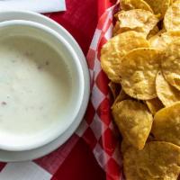 Chips and Queso · House made with white cheese, tomatoes, peppers