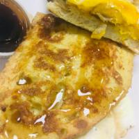 Maple Sausage Griddle Sandwich · French toast breakfast sandwich filled with maple sausage, 2 fried eggs, American cheese and...