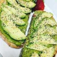 Avocado Toast  · Served with fresh avocado and a garlic sesame topping on toasted Tuscan bread.