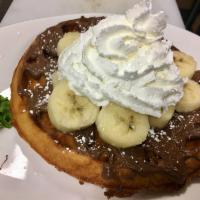 Nutella, Bananas & Cream Waffle · Nutella spread, sliced bananas, whipped cream, powdered sugar and butter with side of maple ...
