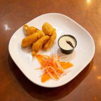 ChilI - Bhajji (V, G) · Fried fritters made of chickpea-battered with stuffed with yellow chilli