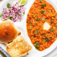 Pav Bhaji · Thick vegetable curry served with a soft bread roll