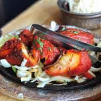 Half Tandoori Chicken · Bone-in chicken marinated with yogurt, fresh herbs and spices and cooked in our tandoor. NOT...