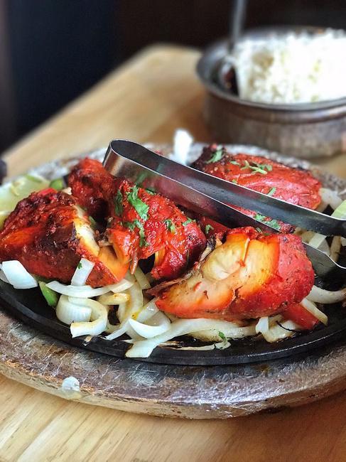 Half Tandoori Chicken · Bone-in chicken marinated with yogurt, fresh herbs and spices and cooked in our tandoor. NOT SERVED WITH RICE OR NAAN.