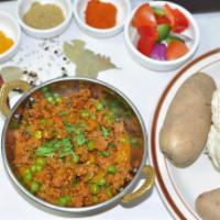 Keema Mutter · Minced lamb with green peas cooked in masala sauce. NOT SERVED WITH RICE OR NAAN.