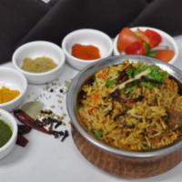 Lamb Biryani · Long-grain basmati rice cooked with lamb, flavored with fresh herbs and spices