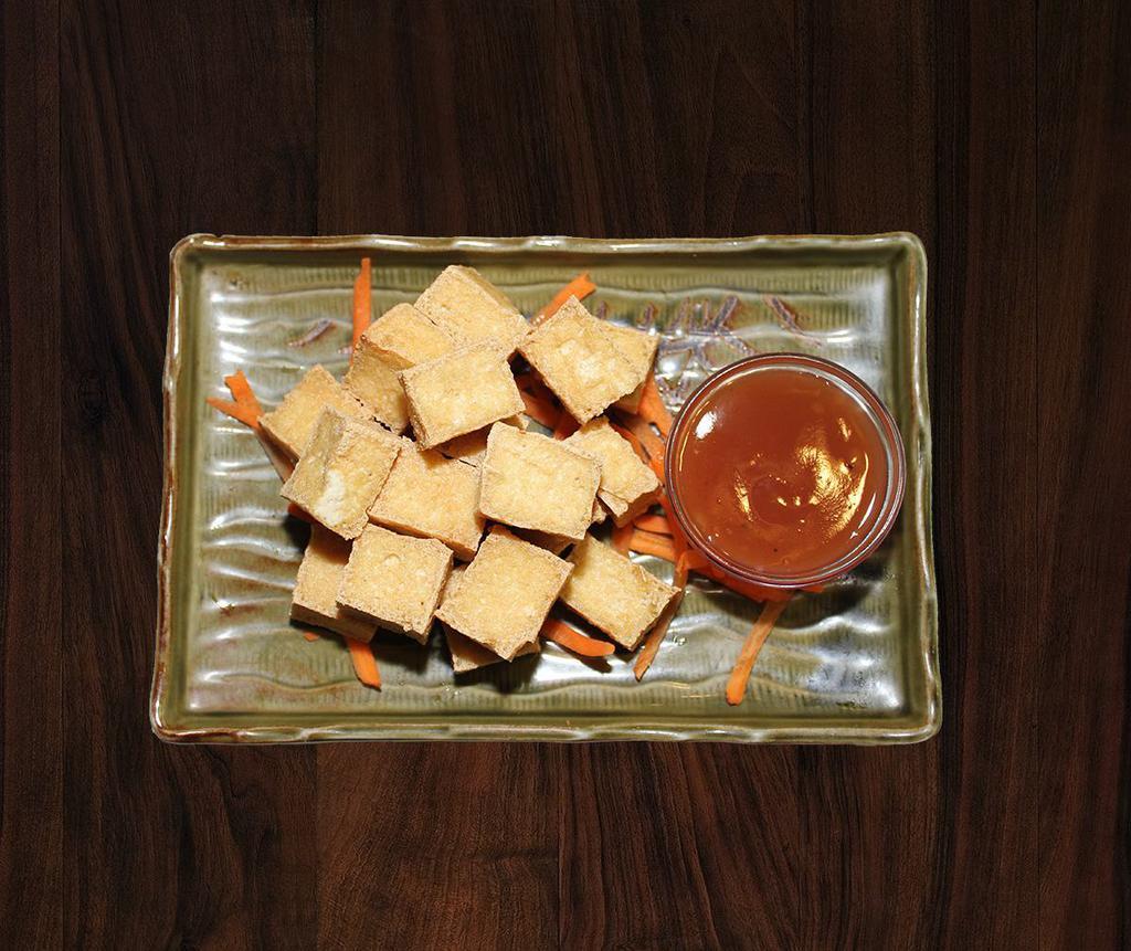 Fried Tofu · Extra film tofu, deep fried until golden brown. Served with sweet chili sauce.