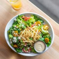 Southwest Caesar Salad · Hearts of romaine, roasted corn and peppers, tomato, tortilla strips, queso fresco, Chipotle...