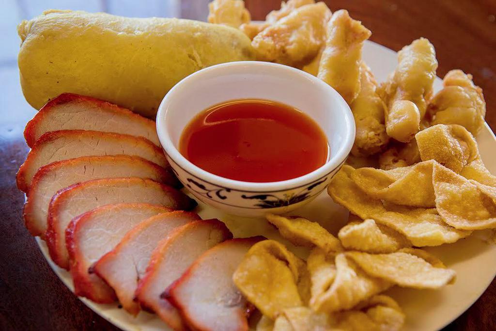 Canton Appetizers Plate · BBQ pork, egg roll, crab puff and sesame chicken.